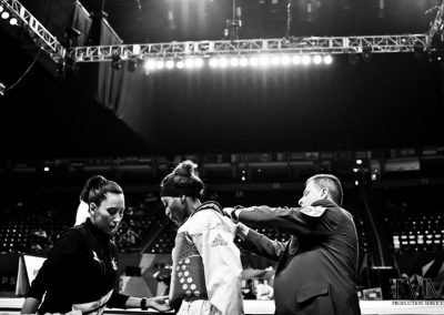 Assisting a competitor with equipment. World Taekwondo Championships, Manchester England. 2019.