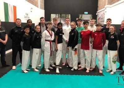 Instructing Irish Taekwondo competitors and referees about current rules just prior to World Championships in Manchester, England. Present were Irish Tokyo Olympic Taekwondo Competitor Jack Woolley, and his coach, Master Robert Taaffe, High Performance Director for the Irish Taekwondo Union. Photo taken at Master Taafe’s dojang, South Dublin Taekwondo. 2019.