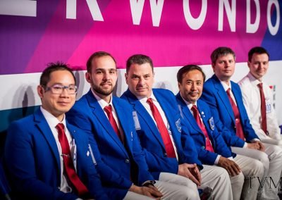 Preparing to perform Technical Assistant (T.A.) duties for a semi-final match, at the World Taekwondo World Championships. Manchester, England, 2019.